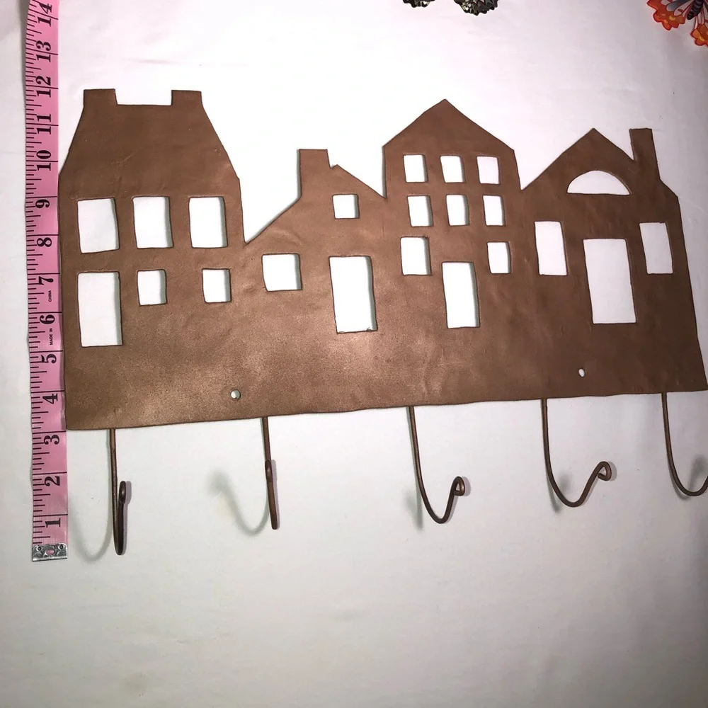 Copper painted metal house wall hanger with hooks, pre-owned